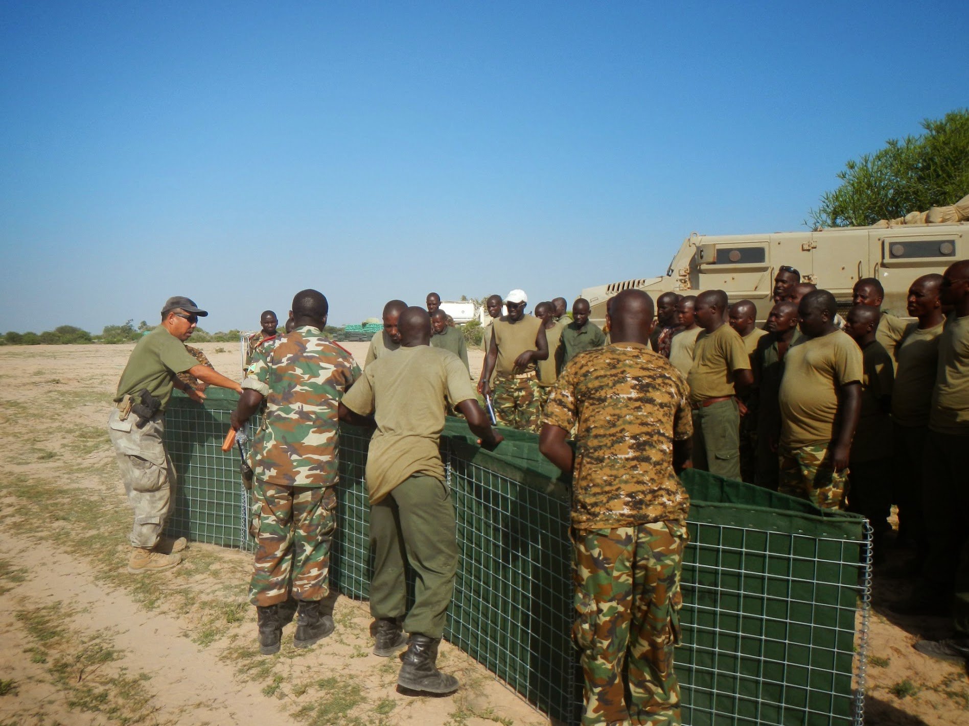 Installation of HESCO barriers by defense or engineering crew